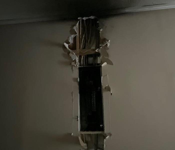 Fire damage on the wall and ceiling due to electrical problems
